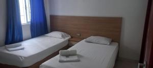 Postel nebo postele na pokoji v ubytování HOTEL GUADALUPE BGA