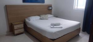 Postel nebo postele na pokoji v ubytování HOTEL GUADALUPE BGA