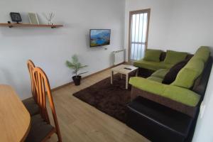 a living room with a couch and a table at Casa Miguel in Teis