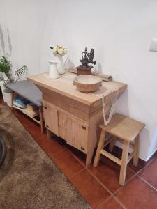 a wooden table with a bowl on top of it at Balada dos Mares Vila in Vila do Conde