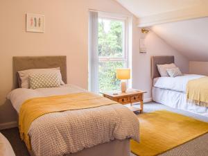 Postel nebo postele na pokoji v ubytování Mutton Hill Cottage