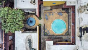 an overhead view of a swimming pool in a building at Contemporary Master Queen Suite in Houston