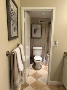 a bathroom with a toilet and towels on the door at Penthouse Beach Front 1st line, 2 BR, 2 BA, New Decoration & Furnitures, unobstructed view of the beautiful Atlantic, free parking in Hollywood