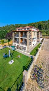 an aerial view of a building with a yard at Penelope Luxury Suites in Fourka