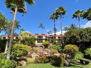 a resort with palm trees and a garden at Live da HI life--great beach and great views! in Wailea