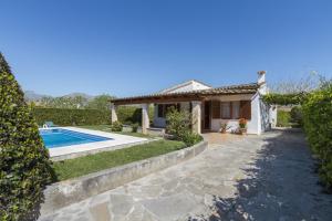 a villa with a swimming pool and a house at Villa Jaume in Pollença