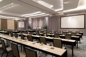 a conference room with tables and chairs and a projection screen at JW Marriott Clearwater Beach Resort & Spa in Clearwater Beach +88 photos