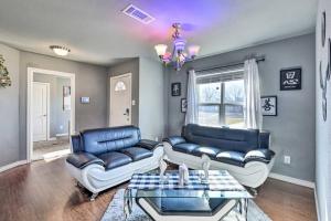 a living room with two couches and a table at Modern Home near Downtown Dallas in Lancaster