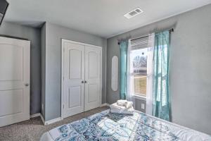 a bedroom with a bed and a window at Modern Home near Downtown Dallas in Lancaster