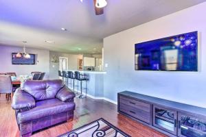 a living room with a couch and a dining room at Modern Home near Downtown Dallas in Lancaster