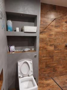 a bathroom with a white toilet in a room at Comfy double room in Corby in Rockingham