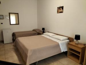 Tempat tidur dalam kamar di Al Capretto d'Oro