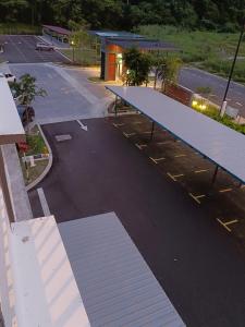 an overhead view of a parking lot with blue ramps at Nasuha Homestay in Sandakan