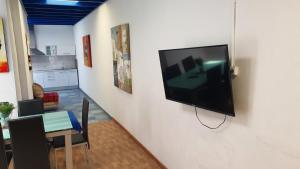 a flat screen tv hanging on a wall in a living room at Marina Lucky in Playa Blanca