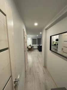 an empty hallway with a room with a table at Family Getaway By The Sea in Jūrmala