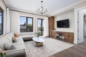 a living room with a couch and a table at Vancouver Vacation Home in Richmond