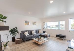 a living room with a couch and a table at 3896 Gather and Rest home in Del Rey Oaks