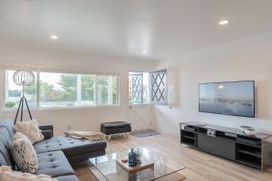 a living room with a couch and a tv at 3896 Gather and Rest home in Del Rey Oaks