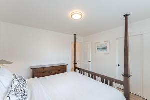 a bedroom with a bed and a dresser in it at 3896 Gather and Rest home in Del Rey Oaks