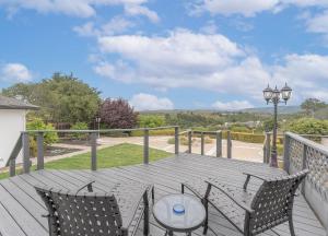 a patio with a table and chairs on a deck at 3896 Gather and Rest home in Del Rey Oaks