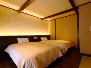 En eller flere senge i et værelse på Kii no Matsushima