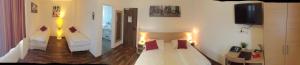 Postel nebo postele na pokoji v ubytování Hotel Platinium
