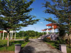a dirt road in a park with trees at Locahouz Homestay Sandakan in Sandakan
