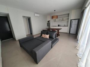 a living room with a couch and a table at Bosques de Mayo - Departamento 1 in Maipú