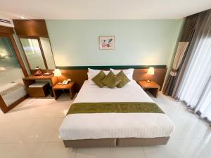 Ένα ή περισσότερα κρεβάτια σε δωμάτιο στο Siam Triangle Hotel Chiang Sean