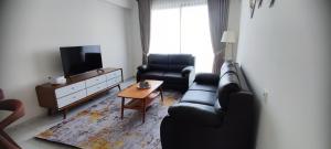Posezení v ubytování 3BR Apartment at Skyhouse BSD beside Aeon Mall BSD