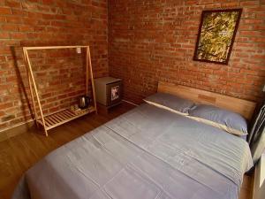 Voodi või voodid majutusasutuse IKIGAI Dorm Hostel - Danang Beach toas