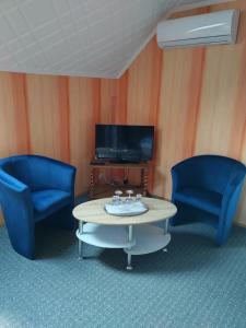 TV a/nebo společenská místnost v ubytování Ibolya Apartman
