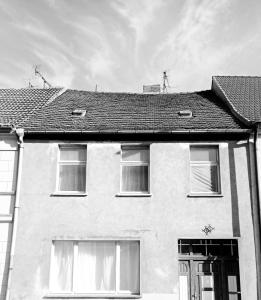 a black and white photo of a house at Velo Dahme - Appartement in historic building in Dahme