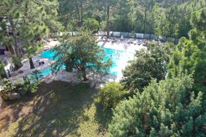 an overhead view of a swimming pool in a park at Camping Mulinacciu in Lecci