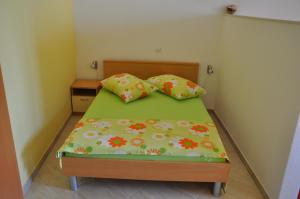 Postel nebo postele na pokoji v ubytování Apartments Dubravka