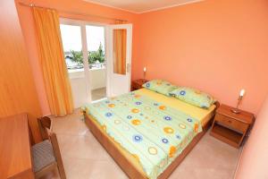 Postel nebo postele na pokoji v ubytování Apartments Dubravka