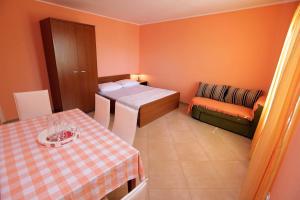 Postel nebo postele na pokoji v ubytování Apartments Dubravka