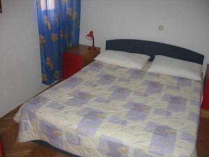 Postel nebo postele na pokoji v ubytování Apartments Dubravka