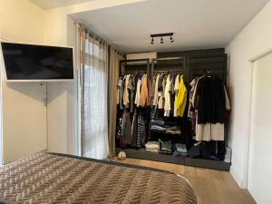 a bedroom with a closet with a bed in it at Stylish apartment @ city centre in Rotterdam