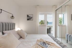 Postel nebo postele na pokoji v ubytování Apartments Marina + 37 fotografií