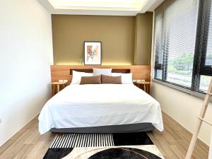 Postel nebo postele na pokoji v ubytování DOME Homestay
