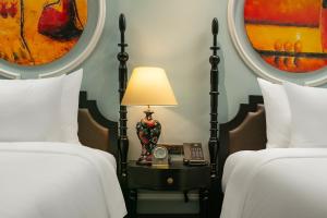 Letto o letti in una camera di Amira Hotel Hanoi