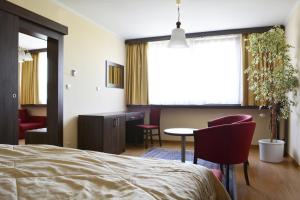Postel nebo postele na pokoji v ubytování Hotel Olympik