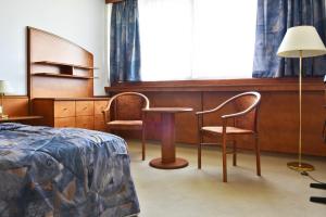 Postel nebo postele na pokoji v ubytování Hotel Olympik