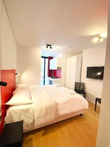 Postel nebo postele na pokoji v ubytování Citizen Suites