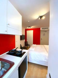 Kuchyň nebo kuchyňský kout v ubytování Citizen Suites