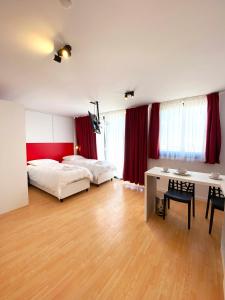 Postel nebo postele na pokoji v ubytování Citizen Suites