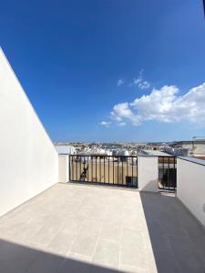 a balcony with a view of a city at Citizen Suites in Sliema