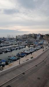 a bunch of boats are docked in a harbor at Affittacamere il Labirinto in Bisceglie