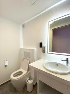 Koupelna v ubytování Citizen Suites
